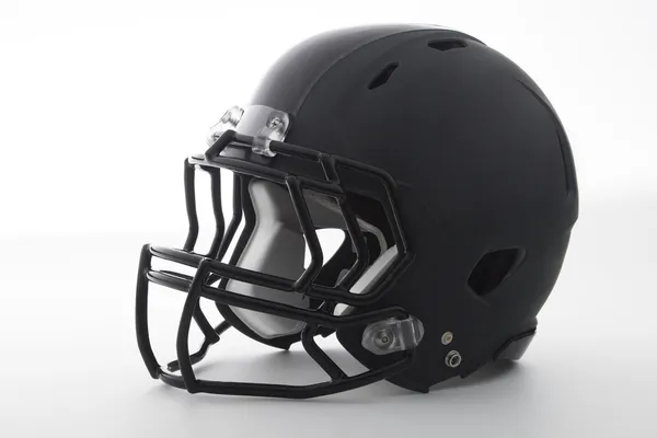 Футбольный шлем черный на белом Стоковое Фото