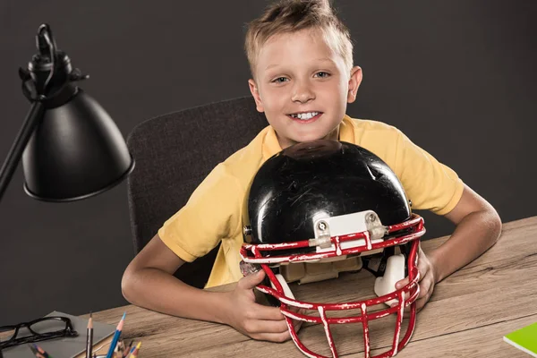 Happy Schoolboy Sitting American Football Helmet Table Eyeglasses Lamp Colour Стоковая Картинка
